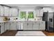 Updated kitchen featuring granite counters, subway tile backsplash, and stainless appliances at 2318 Plantation Dr, Atlanta, GA 30344