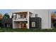 Striking two-story home with a second floor balcony overlooking landscaped backyard at 360 Campground Road, Mcdonough, GA 30253