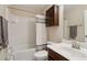 Bathroom features shower and tub combination, cabinet, and granite vanity at 6160 Shiloh Woods Dr, Cumming, GA 30040