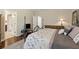 Bedroom showcasing a large bed, neutral carpet, and ample room at 6160 Shiloh Woods Dr, Cumming, GA 30040