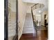Inviting foyer with hardwood floors, staircase, and views into other living areas at 6160 Shiloh Woods Dr, Cumming, GA 30040