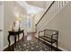 Welcoming foyer featuring hardwood floors, staircase, elegant decor, and ample natural light at 6160 Shiloh Woods Dr, Cumming, GA 30040