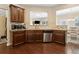 Spacious kitchen with stainless steel appliances, granite countertops, and an open design to the dining area at 6160 Shiloh Woods Dr, Cumming, GA 30040