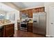Well-equipped kitchen with stainless steel appliances, granite counters, and ample cabinet space at 6160 Shiloh Woods Dr, Cumming, GA 30040