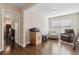 Hardwood floored living room with a comfortable seating arrangement and a bright, airy atmosphere at 6160 Shiloh Woods Dr, Cumming, GA 30040