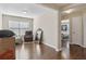 Bright living room featuring hardwood floors and large window that provides plenty of natural light at 6160 Shiloh Woods Dr, Cumming, GA 30040