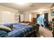 Bright bedroom with carpet floors, closet, and natural light from the sliding glass doors at 990 Fox Valley Trl, Stone Mountain, GA 30088