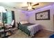 Comfortable bedroom featuring a stylish bed, accent lighting, and a desk area with pink chair at 990 Fox Valley Trl, Stone Mountain, GA 30088