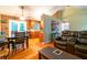 View of living room, dining, and kitchen area with an open floor plan design and lots of space at 990 Fox Valley Trl, Stone Mountain, GA 30088