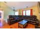 Spacious living room with vaulted ceiling, natural light and a large sectional sofa with cup holders at 990 Fox Valley Trl, Stone Mountain, GA 30088