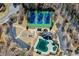 Aerial shot showcases tennis courts, a community pool and playground nestled within a serene landscape at 1110 Croftmoore Lndg, Suwanee, GA 30024