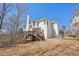 Exterior of house showing back deck and fenced in backyard at 1110 Croftmoore Lndg, Suwanee, GA 30024