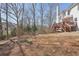 Large backyard surrounded by mature trees at 1110 Croftmoore Lndg, Suwanee, GA 30024