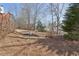 Landscaped backyard with mature trees at 1110 Croftmoore Lndg, Suwanee, GA 30024