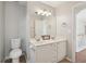 A bathroom featuring a dual vanity, a tile floor, and modern fixtures at 1110 Croftmoore Lndg, Suwanee, GA 30024