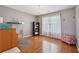 Bedroom with hardwood floors, chandelier, and large window at 1110 Croftmoore Lndg, Suwanee, GA 30024