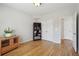 A bedroom features a hardwood floor, neutral walls, a wooden cabinet and 2 closets with doors at 1110 Croftmoore Lndg, Suwanee, GA 30024
