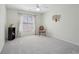 Bedroom with neutral carpet, ceiling fan and good light at 1110 Croftmoore Lndg, Suwanee, GA 30024