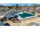 Aerial view of a covered community pool with surrounding lounge area and landscaping at 1110 Croftmoore Lndg, Suwanee, GA 30024