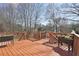 Beautiful wooden deck showcasing railings and flower planters, perfect for outdoor relaxation and entertaining at 1110 Croftmoore Lndg, Suwanee, GA 30024