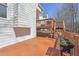 A spacious two-tiered wooden deck is perfect for outdoor gatherings and enjoying the surrounding scenery at 1110 Croftmoore Lndg, Suwanee, GA 30024