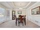 Dining room with decorative molding, chandelier, and large windows at 1110 Croftmoore Lndg, Suwanee, GA 30024
