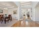 Open foyer with hardwood floors, staircase, and view of the living room at 1110 Croftmoore Lndg, Suwanee, GA 30024