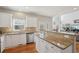 Bright kitchen with granite countertops, stainless steel appliances and wood floors offers a functional and stylish space at 1110 Croftmoore Lndg, Suwanee, GA 30024