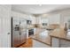 Modern kitchen with stainless steel appliances, granite countertops, and white cabinets at 1110 Croftmoore Lndg, Suwanee, GA 30024