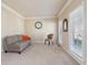 Cozy living room with neutral carpet, offering a comfortable and inviting space for relaxation at 1110 Croftmoore Lndg, Suwanee, GA 30024