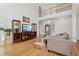 Open-concept living area with hardwood floors, high ceilings, and stylish furnishings at 1110 Croftmoore Lndg, Suwanee, GA 30024