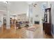 Open-concept living room with hardwood floors, high ceilings, and abundant natural light at 1110 Croftmoore Lndg, Suwanee, GA 30024