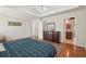 Spacious main bedroom featuring hardwood floors, tray ceiling, and ensuite bath access at 1110 Croftmoore Lndg, Suwanee, GA 30024