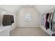 Walk-in closet featuring a large window, shelving, and ample storage space at 1110 Croftmoore Lndg, Suwanee, GA 30024