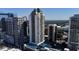An aerial view showcasing a luxurious high-rise surrounded by lush greenery and neighborhood amenities at 1280 W Peachtree Nw St # 1712, Atlanta, GA 30309