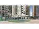 Basketball court and pool area surrounded by modern high-rise buildings for residents' leisure at 1280 W Peachtree Nw St # 1712, Atlanta, GA 30309