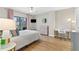 Inviting bedroom with a ceiling fan, desk, and balcony access, providing both comfort and convenience at 1280 W Peachtree Nw St # 1712, Atlanta, GA 30309