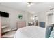 Cozy bedroom with modern furniture, a ceiling fan, and hardwood floors, creating a serene and comfortable atmosphere at 1280 W Peachtree Nw St # 1712, Atlanta, GA 30309
