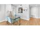 The dining area is bright and open, featuring a modern glass table and seating for four at 1280 W Peachtree Nw St # 1712, Atlanta, GA 30309