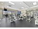 Bright fitness center with modern weight machines, black rubber flooring, and large windows at 1280 W Peachtree Nw St # 1712, Atlanta, GA 30309