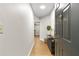 Hallway view shows the open door, modern decor, and wood-look flooring at 1280 W Peachtree Nw St # 1712, Atlanta, GA 30309