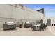 Outdoor kitchen with modern grills, a dining table, and seating, ideal for entertaining guests at 1280 W Peachtree Nw St # 1712, Atlanta, GA 30309