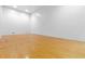 Bright racquetball court with hardwood floors and white walls, perfect for a recreational workout at 1280 W Peachtree Nw St # 1712, Atlanta, GA 30309
