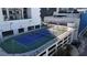 The complex's tennis court and rooftop pool, surrounded by the cityscape and neighborhood at 1280 W Peachtree Nw St # 1712, Atlanta, GA 30309