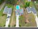 Aerial view of a single Gathering home featuring a backyard swimming pool, and lots of mature trees at 2061 Emerald Dr, Loganville, GA 30052