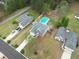 Beautiful aerial view of home with a private pool and well-manicured lawn in a desirable neighborhood at 2061 Emerald Dr, Loganville, GA 30052