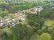 Aerial view of a lovely home, property line, pool, and lush greenery, nestled in a peaceful neighborhood at 2061 Emerald Dr, Loganville, GA 30052