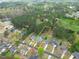 Aerial view of home, property line, pool and backyard in a lush green neighborhood at 2061 Emerald Dr, Loganville, GA 30052
