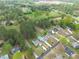 Aerial view of home featuring a refreshing swimming pool, well-manicured lawn, and charming neighborhood at 2061 Emerald Dr, Loganville, GA 30052