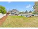 Large backyard featuring a refreshing in-ground pool, lounge chairs, and privacy fence at 2061 Emerald Dr, Loganville, GA 30052